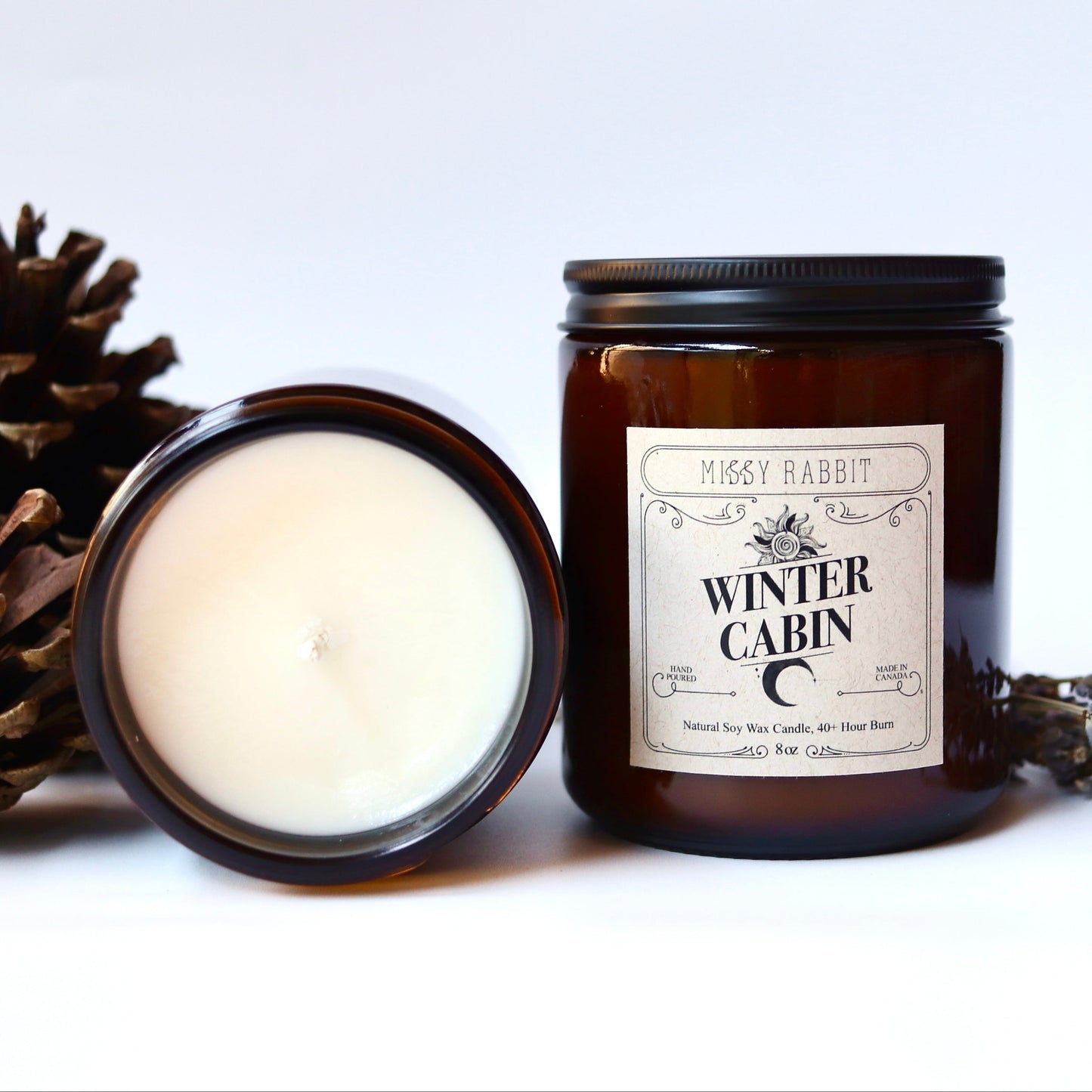 Two candles, one open and one closed, with decorative elements on a white background