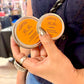 two different sizes of beeswax based hand salve